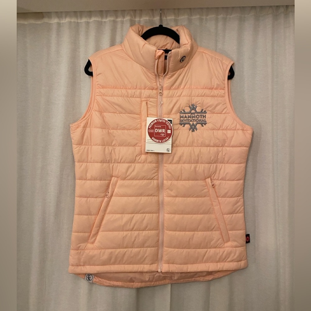 Pink puffy vest with Mammoth Invitational emblem